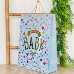 Decorative baby gift bag with lettering and gold details, 31 x 42 x 12 cm